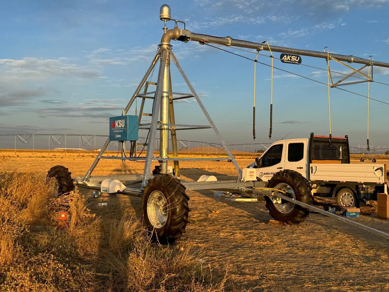 The same pivot point and span at sunset, with the AksuPivot decal on the truss